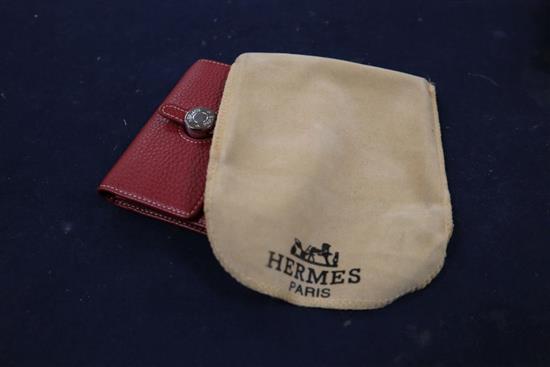 A Hermes, Paris red leather purse and cloth cover